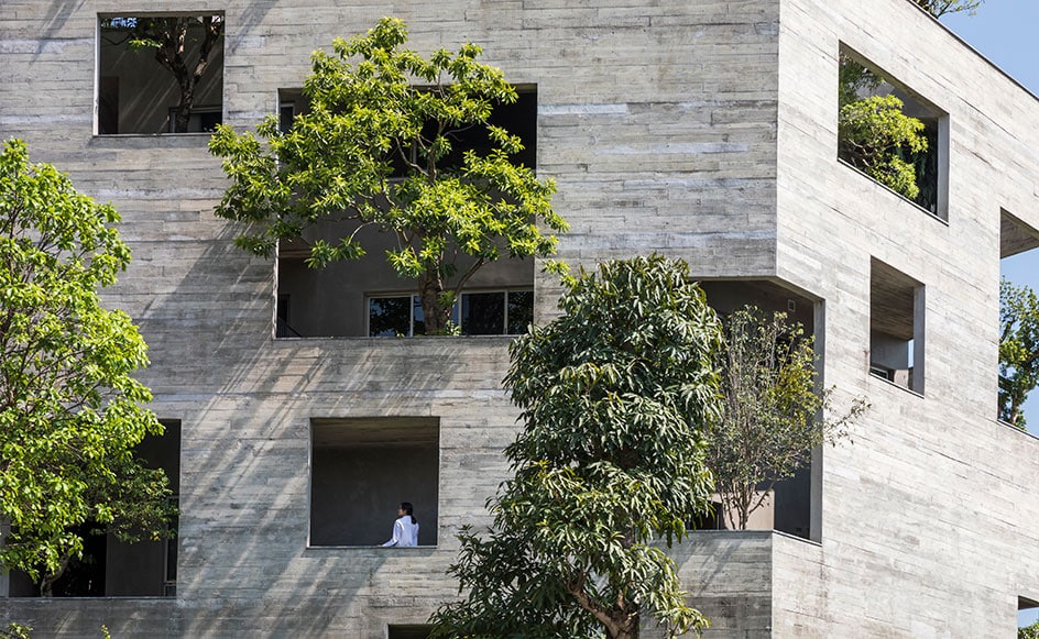 Trees growing through openings in the walls of Vo Trong Nghia Architects’ Ha Long Villa in Vietnam offer ventilation and shade