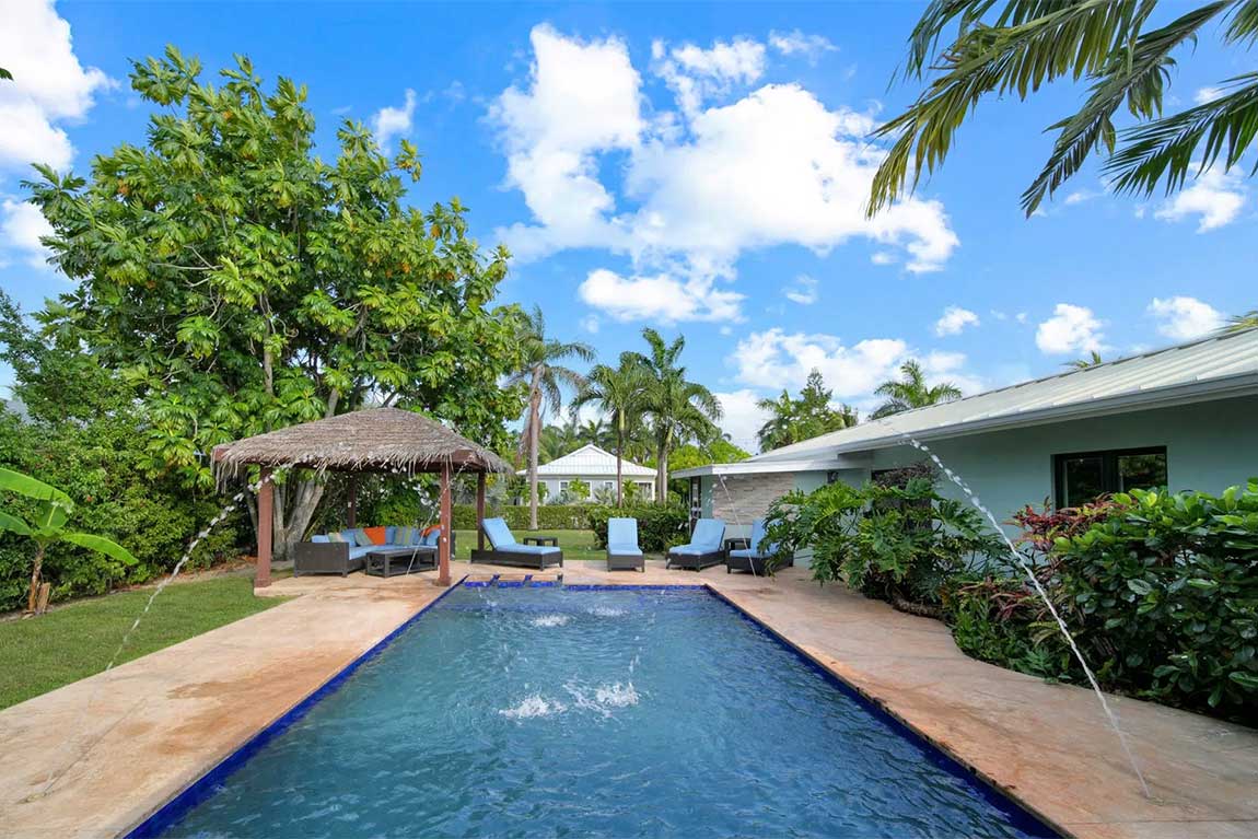 Modern ranch style home with lush landscaping, and plenty of private outdoor space