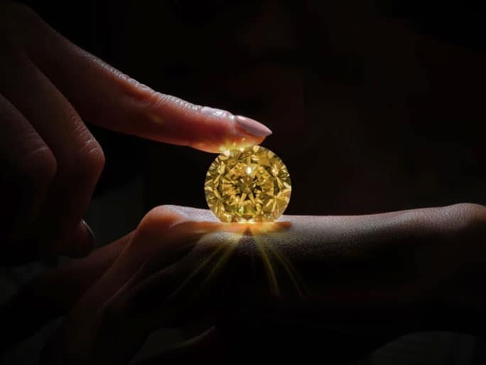 The Aten, A 67.2-Carat Spectacular Fancy Vivid Yellow Diamond and Diamond Ring | Estimate: 28,000,000 - 39,000,000 HKD